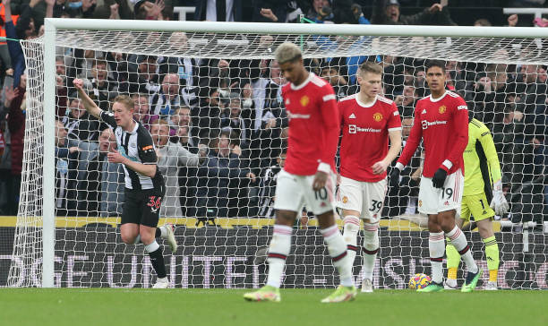 Marcus Rashford, Scott McTominay, Raphael Varane of Manchester United reacts to conceding a goal to Allan Saint-Maximin of Newcastle United during...