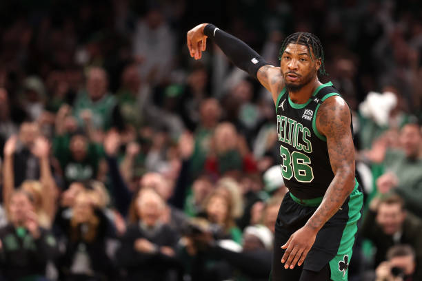 Marcus Smart of the Boston Celtics celebrates after scoring against the Brooklyn Nets during the first quarter of Round 1 Game 1 of the 2022 NBA...