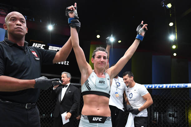 Marina Rodriguez of Brazil celebrates her victory over Mackenzie Dern in their women's strawweight bout during the UFC Fight Night event at UFC APEX...
