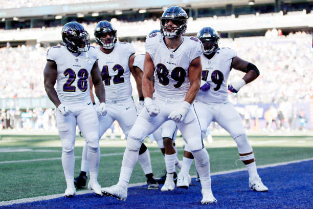 Mark Andrews of the Baltimore Ravens celebrates with teammates after catching a pass for a touchdown during the fourth quarter against the New York...