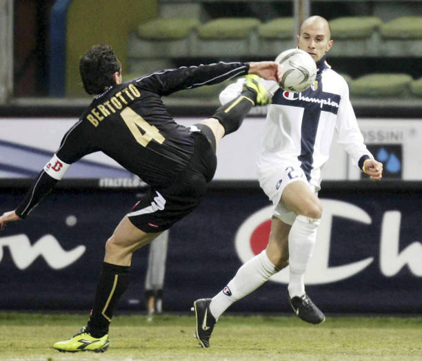Mark Bresciano of Parma and Valerio Bertotto of Udinese in action during thwe Serie A match between Parma and Udinese at the Stadio Ennio Tardini on...