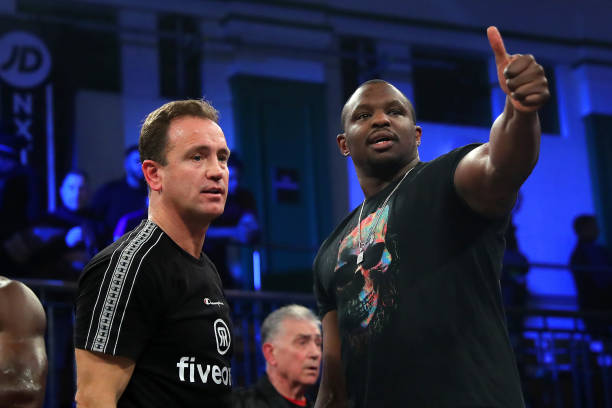 Mark Tibbs and Dillian Whyte are seen in the ring after the British Curiserweight Title fight between Richard Riakporhe and Jack Massey at York Hall...