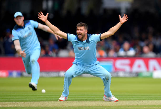 Mark Wood of England celebrates dismissing Tom Latham of New Zealand during the Final of the ICC Cricket World Cup 2019 between New Zealand and...