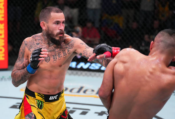 Marlon Vera of Ecuador punches Rob Font in a bantamweight fight during the UFC Fight Night event at UFC APEX on April 30, 2022 in Las Vegas, Nevada.