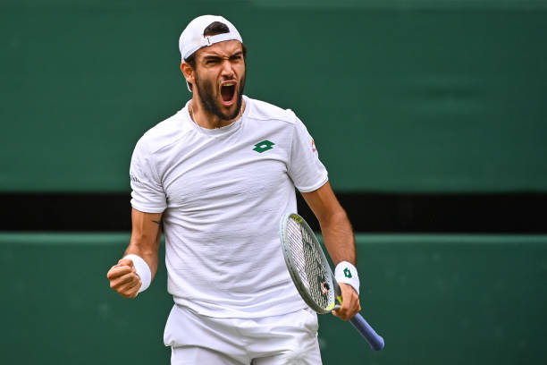 Mateo Berrettini of Italy celebrates during his match against Novak Djokovic of Serbia in the final of the gentlemen's singles during Day Thirteen of...