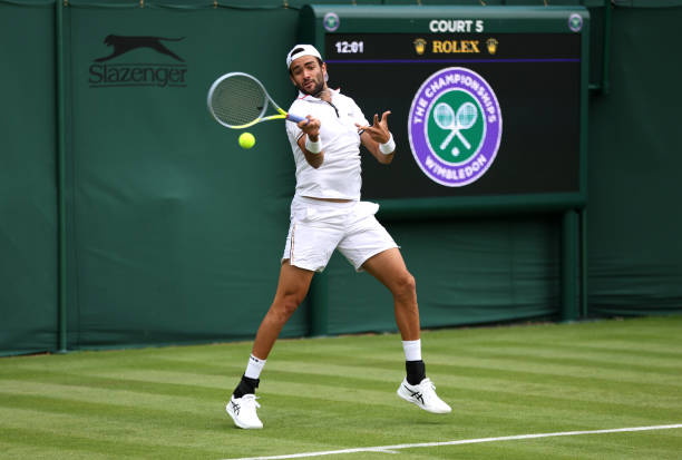 Matteo Berrettini of Italy plays a forehand during a practice session ahead of The Championships Wimbledon 2022 at All England Lawn Tennis and...