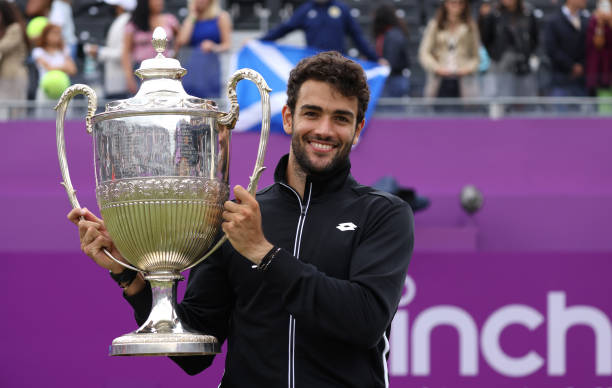 Matteo Berrettini of Italy poses with the trophy after winning the The cinch Championships during Day 7 of The cinch Championships at The Queen's...