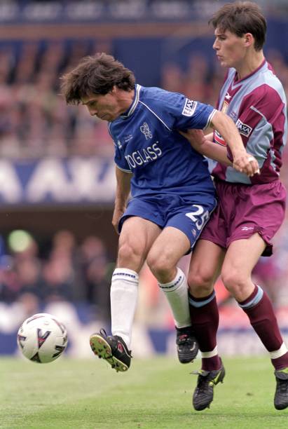 Gianfranco Zola of Chelsea is challenged by Gareth Brown of Aston Villa during the AXA FA Cup Final at Wembley Stadium in London, England. Chelsea...