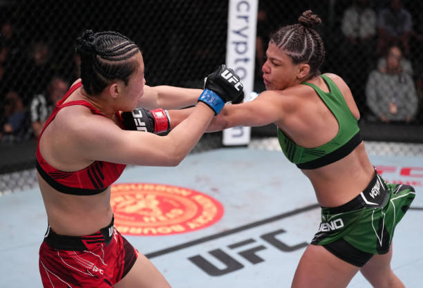 Mayra Bueno Silva of Brazil punches Wu Yanan of China in a bantamweight fight during the UFC Fight Night event at UFC APEX on April 16, 2022 in Las...
