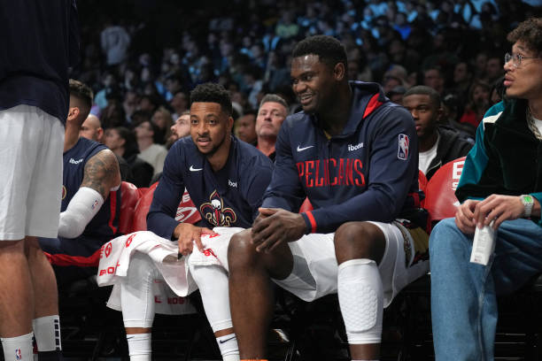 McCollum and Zion Williamson of the New Orleans Pelicans look on during the game against the Brooklyn Nets on October 19, 2022 at Barclays Center in...