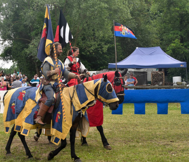Medieval jousting event of knights on horses in German traditional festival of Hallbergmoos, Munich, Germany