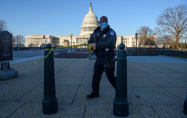 Member of the Capitol police tapes off access to the US Capitol in Washington, DC, on January 7 one day after supporters of outgoing President Donald...