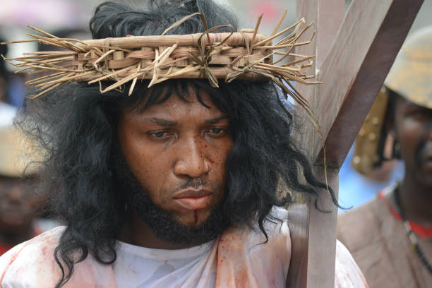 Members of St. Leo Catholic Church, Ikaja in Lagos Nigeria, dramatize the Station of the Cross, suffering and death of Jesus Christ on Good Friday,...