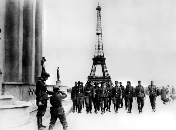 Members of the SS visiting the Eiffel Tower, Paris, July 1940.
