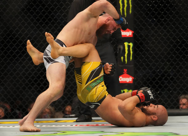 Merab Dvalishvili of Georgia punches Marlon Moraes of Brazil during the UFC 266 event on September 25, 2021 in Las Vegas, Nevada.