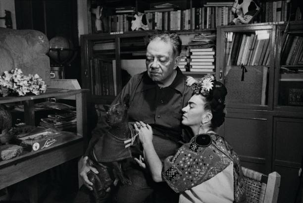 Mexican artists Frida Kahlo and Diego Rivera with a dog, Mexico City, 1952.