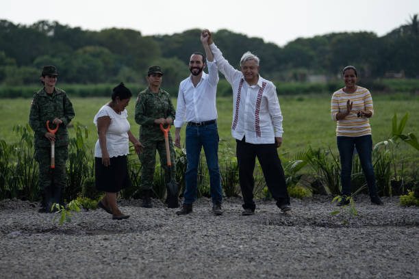 Mexico President Manuel Lopez Obrador and El Salvador President Nayib Bukele wave during a joint press conference launching the Planting Life...