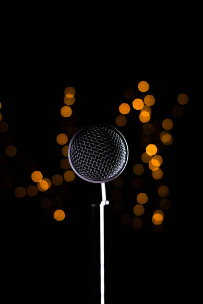 Microphone - Lights,Close-up of microphone against illuminated lights at night