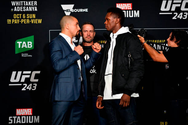 Middleweight champion Robert Whittaker of New Zealand and UFC interim middleweight champion Israel Adesanya of New Zealand face off for the media...