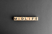 midlife - word from wooden blocks with letters