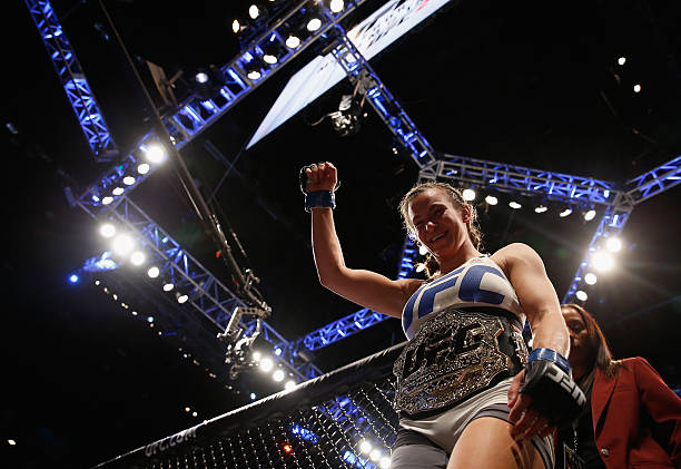 Miesha Tate exits the Octagon after defeating Holly Holm in their UFC women's bantamweight championship bout during the UFC 196 event inside MGM...