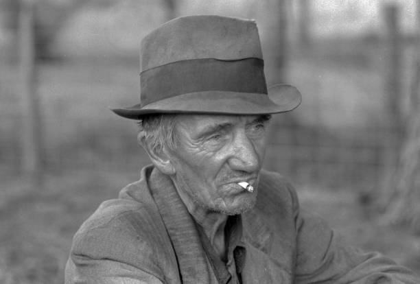 migrant-worker-resting-along-roadside-hancock-county-mississippi-by-picture-id481656589