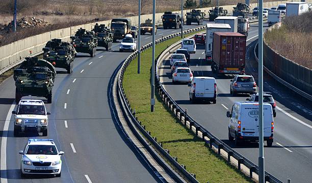 military-convoy-arrives-in-prague-after-entering-the-czech-republic-picture-id468118120