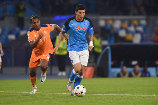 Min-Jae Kim of SSC Napoli competes for the ball with Alfredo Morelos of Rangers FC during the UEFA Champions League match between SSC Napoli and...