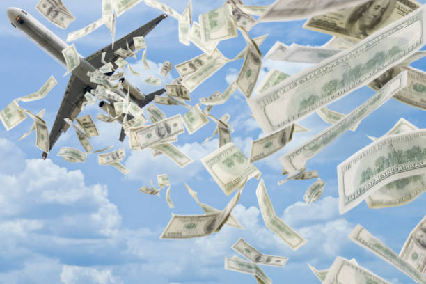 money falling in sky under airplane picture