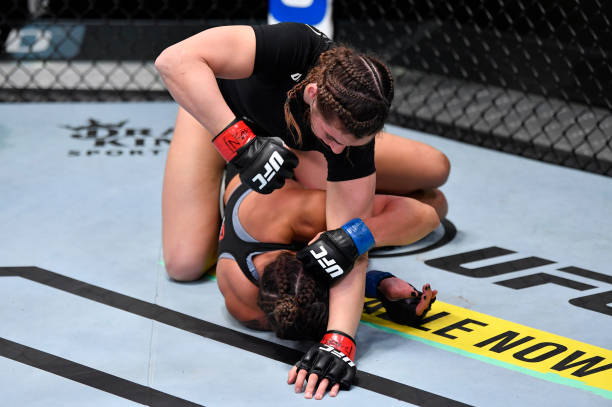 Montana De La Rosa punches Mayra Bueno Silva of Brazil in a flyweight bout during the UFC Fight Night event at UFC APEX on February 27, 2021 in Las...
