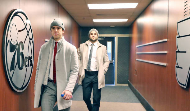 Morgan Frost and Andy Anderoff of the Philadelphia Flyers enter the building on route to the locker room prior to their game against the New York...