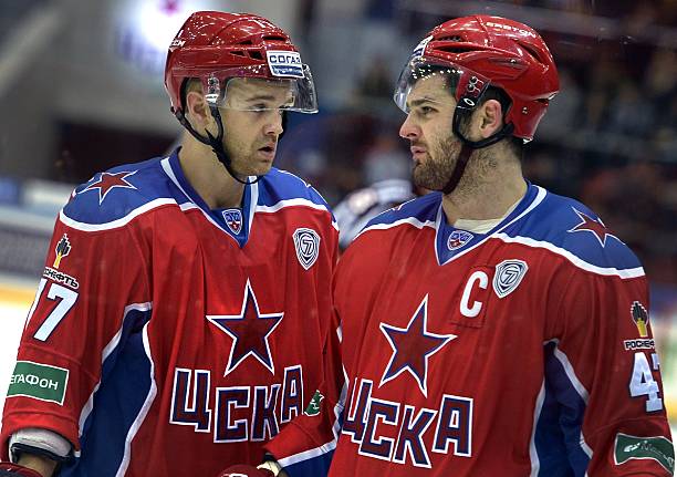 Moscow's French center Stephane Da Costa talks to his team captain Alexander Radulov during a match against Lada Togliatti on September 23, 2014 in...