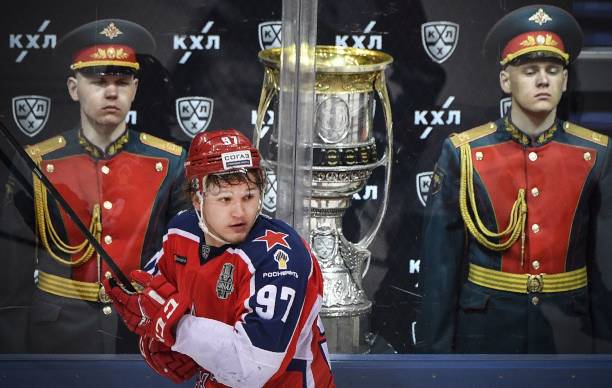 Moscow's Kirill Kaprizov skates by the Gagarin Cup trophy displayed at the arena during game 2 of Gagarin Cup 2019 final series of the Russian...