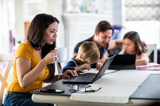 mother working from home while children attend school online picture id1296484195?k=6&m=1296484195&s=612x612&w=0&h=o4 FJ5LA4WnWZ2s JyGz4JMbGmw2SwSnLPaCTM8I 2I=