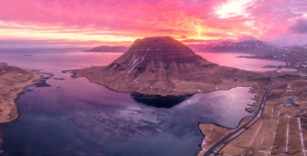 mount kirkjufell is a beautiful waterfall on the island of iceland. beautiful aerial views using a drone. - kirkjufell mountain stock pictures, royalty-free photos & images
