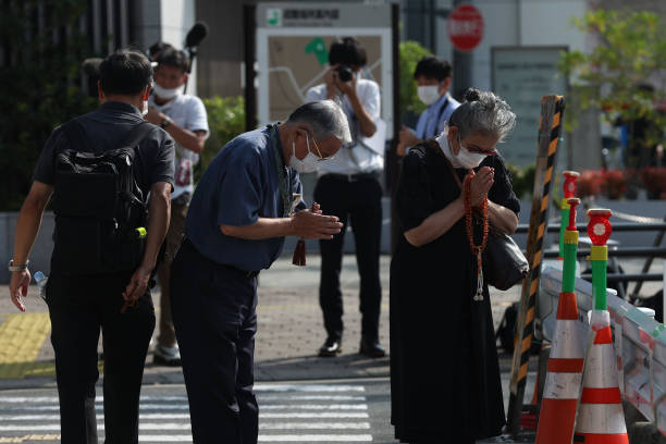 JPN: People Offer Flowers And Prayers For Former PM Abe