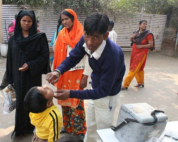 Muslim Child getting Polio Vaccine