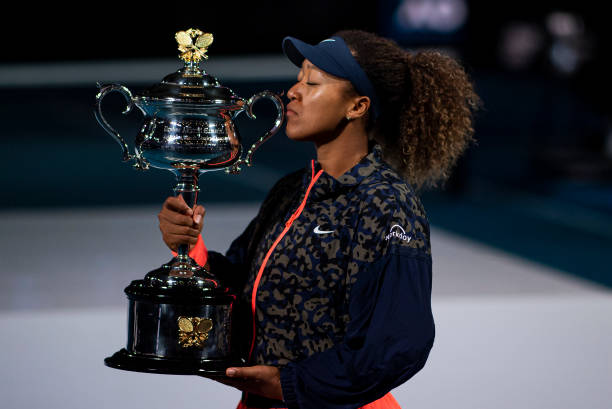 Naomi Osaka of Japan celebrates with the Trophy after defeating Jennifer Brady of the United States in the women's singles final, during day 13 of...