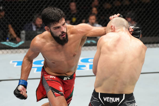 Nasrat Haqparast of Germany punches John Makdessi of Canada in a lightweight fight during the UFC Fight Night event at The Accor Arena on September...