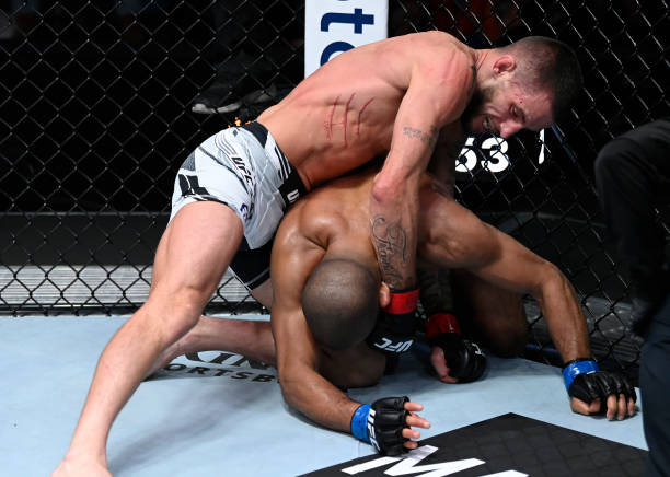Nate Maness punches Tony Gravely in a bantamweight fight during the UFC Fight Night event at UFC APEX on September 18, 2021 in Las Vegas, Nevada.