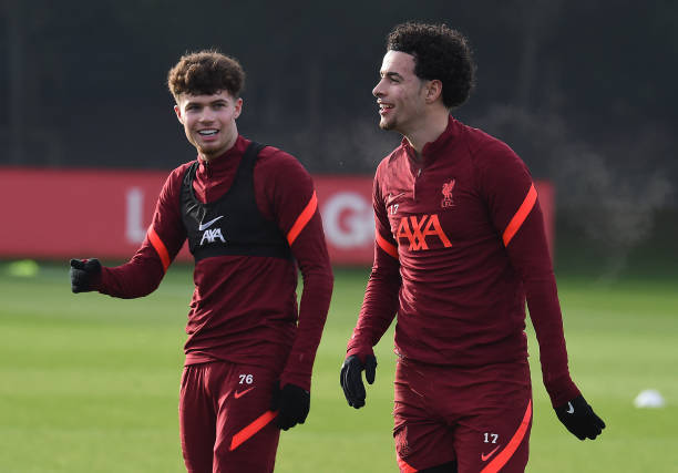 Neco Williams of Liverpool with Curtis Jones of Liverpool during a training session at AXA Training Centre on December 24, 2021 in Kirkby, England.