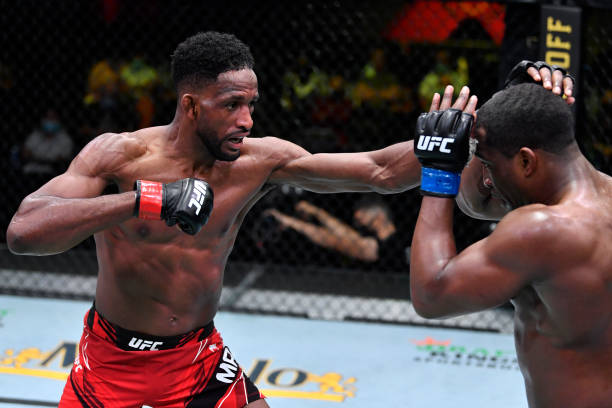 Neil Magny punches Geoff Neal in a welterweight fight during the UFC Fight Night event at UFC APEX on May 08, 2021 in Las Vegas, Nevada.