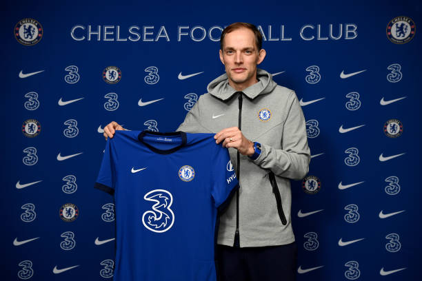 New manager Thomas Tuchel of Chelsea holds up the home Nike Shirt at Stamford Bridge on January 27, 2021 in London, England.