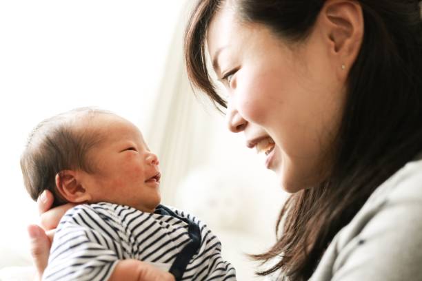 newborn baby and mother - asian mother holding a baby stock pictures, royalty-free photos & images