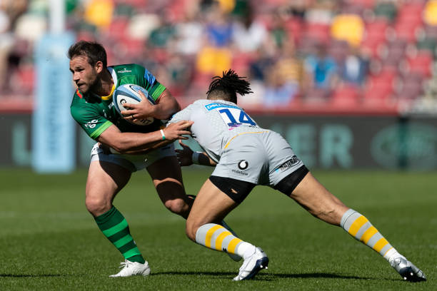 Nic Groom of London Irish is tackled by Marcus Watson of Wasps during the Gallagher Premiership match between London Irish and Wasps at the Brentford Community Stadium, Brentford on Saturday 5th June 2021. (Photo by Juan Gasparini/MI News/NurPhoto via Getty Images)