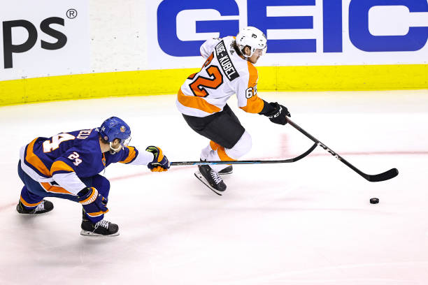 Nicolas Aube-Kubel of the Philadelphia Flyers is defended by Scott Mayfield of the New York Islanders during the second period in Game Six of the...