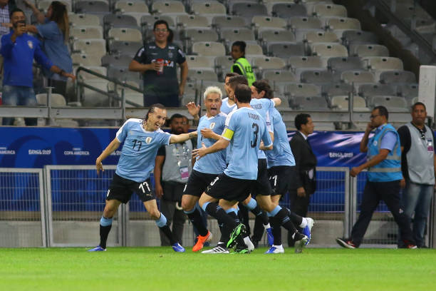Nicolas Lodeiro of Uruguay celebrates with teammates after scoring the first goal of his team during a match between Uruguay and Ecuador at Mineirao...