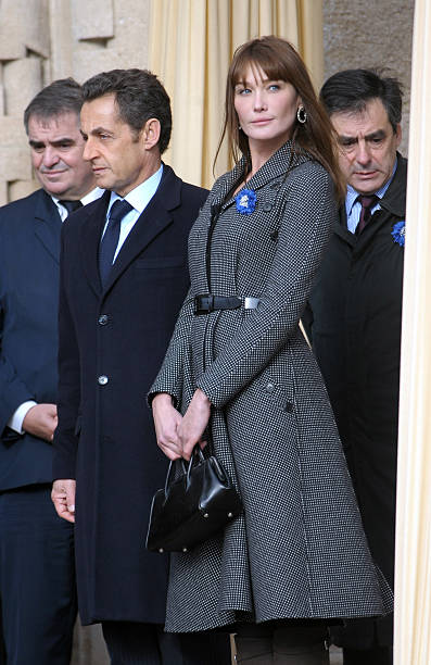 nicolas-sarkosy-and-his-wife-carla-brunisarkozy-leaves-the-douaumont-picture-id98288404