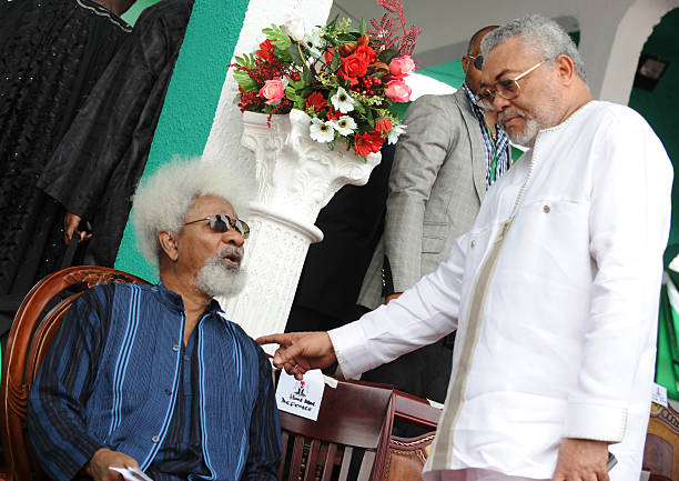 Nigerian Literature Nobel Wole Soyinka and former Ghanaian President Jerry Rawlings chat as they attend the national interdenominational funeral...