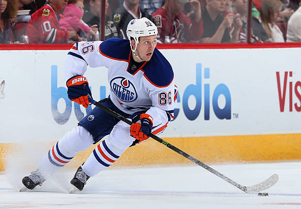 nikita-nikitin-of-the-edmonton-oilers-skates-with-the-puck-during-the-picture-id457686286